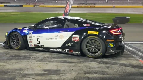 GT car into pits Stock Footage 149899340
