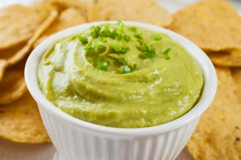 Guacamole with corn chips close-up Stock Photos