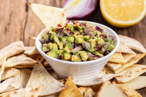 Guacamole with corn chips closeup Stock Photos