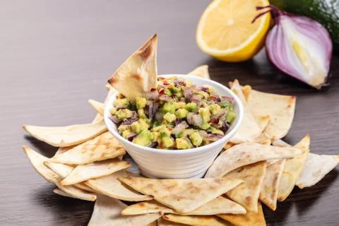 Guacamole with corn chips closeup Stock-Fotos