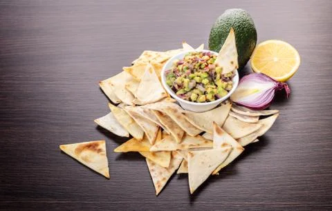 Guacamole with corn chips closeup Stock Photos