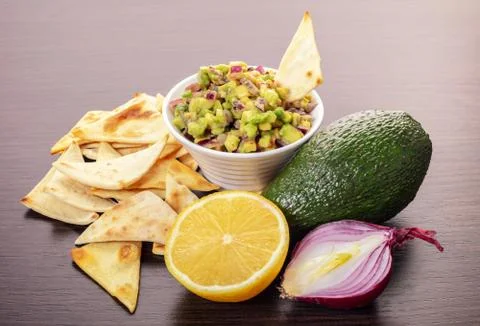 Guacamole with corn chips closeup Stock Photos