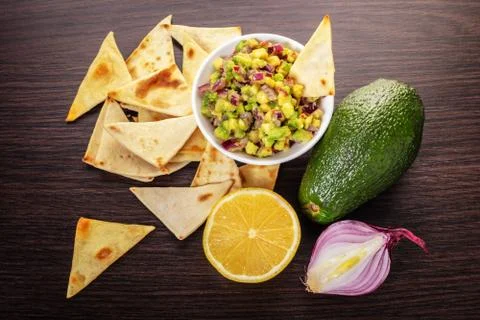 Guacamole with corn chips closeup Stock Photos
