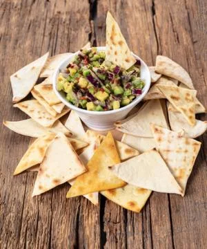 Guacamole with corn chips closeup Stock Photos