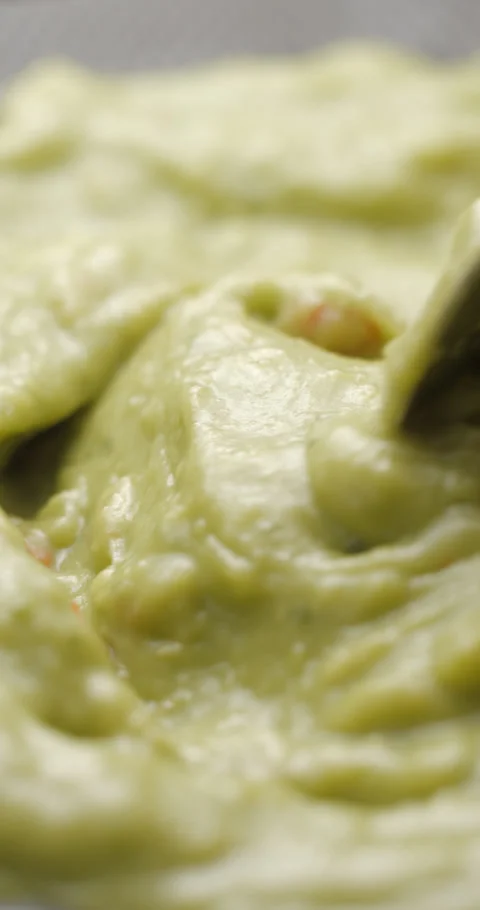 Guacamole preparing close up slowmotion, vertical view Stock Footage 280520506