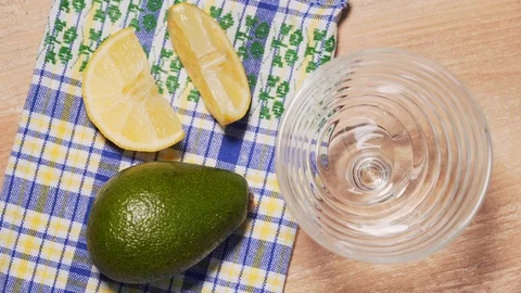 Guacamole recipe, final step. The chef puts the ready-made guacamole in a Stock Footage 125712046