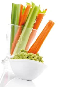 Guacamole with vegetable sticks Stock Photos