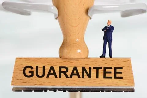 Guarantee printed on rubber stamp Stock Photos