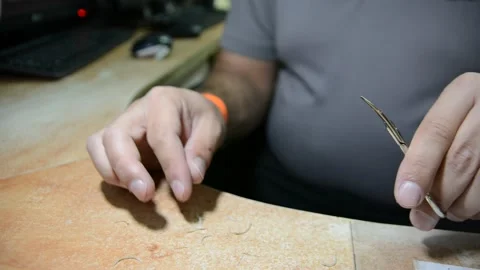 The guard cuts off nails at the workplace.  close-up.  quarantine due to coronav Stock Footage 139532623
