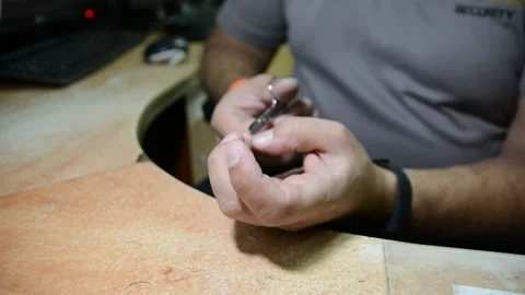 The guard cuts off nails at the workplace.  close-up.  quarantine due to coronav Видео 139532823