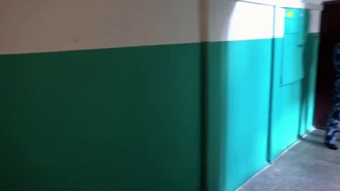 Guard dressed in military uniform guards the apartment 動画素材 75818317
