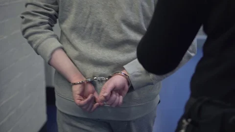 Guard Escorts Prisoner With Handcuffs, 4K Incarceration Prison Corridor Walk Stock Footage