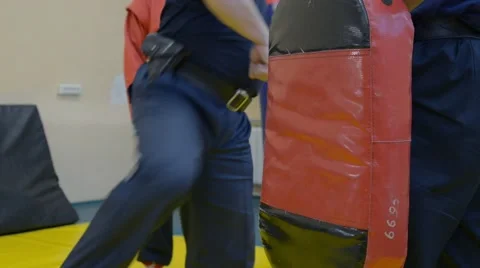 Guard hits punching bag Video stock 62448799