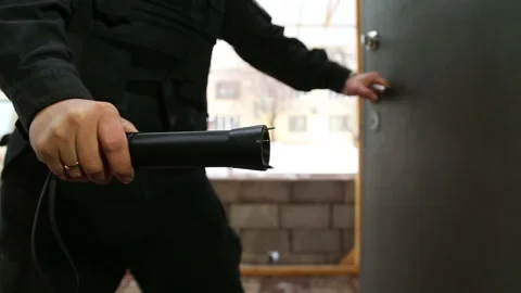 The guard includes a stun gun Stock-Footage 105536653