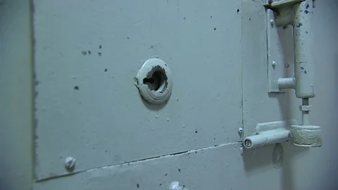 The guard opens the door to the prison cell Video stock 75454869