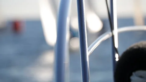 Guard rail moving up and down in slow motion with defocused regatta background Stock Footage 130465937