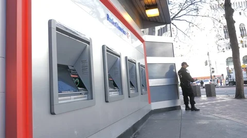 Guard Stands By ATM Video stock 121163754