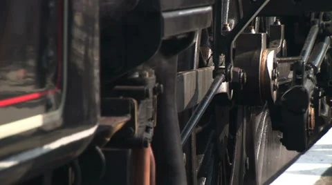 Guard Steam train driver alights his engine with steam surrounding Stock-Footage 39887649