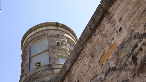 Guard Tower and Rock Wall of Old Prison - Shallow Depth of Field Stock Footage 246119170