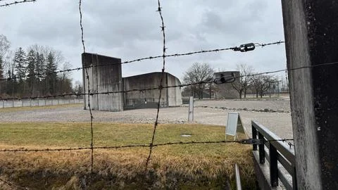 Guard Tower Behind Barbed Wire at Dachau Memorial Stock Photos
