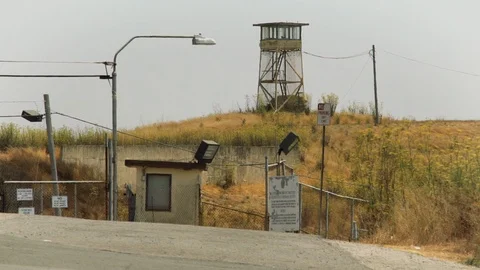 A guard tower keeps watch over the western gate of San Quentin State Prison Stock Footage 96128519