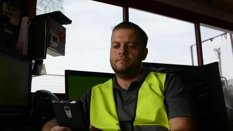 Guard  in uniform plays on smartphone at workplace. Stock-Footage 108540937
