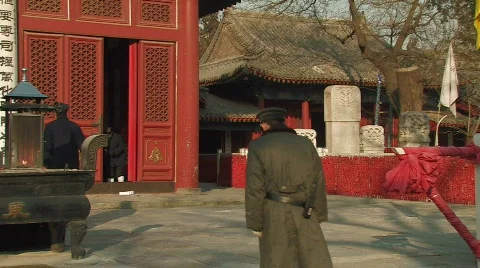 Guard walking inside Dongyue Taoist Temple in Beijing, China Stock Footage