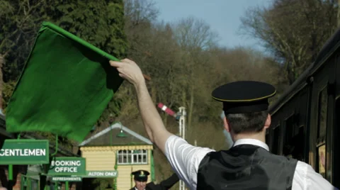 Guard waving green flag and train moving off 스톡 동영상 35964641