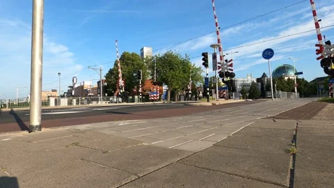 Guarded railway crossing with train Stock Footage 157666305