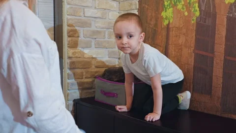 Guardian attentively observes kid having cheerful and carefree moments. Family Vídeos de archivo 346201558