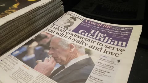 GUARDIAN NEWSPAPER HEADLINES ON WEEKEND OF QUEEN ELIZABETH II DEATH 4K Stock Footage 210893201