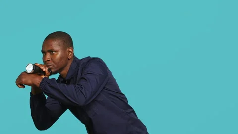 Guardian prepared to handle security breaches, doing pistol fingers gesturing Stock Footage 278066179