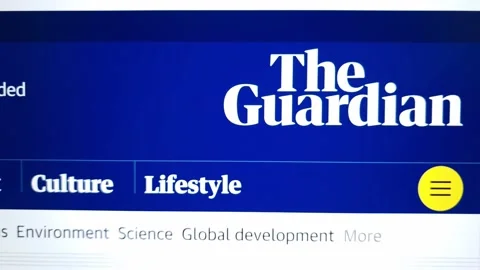 The Guardian website displayed on laptop computer Vídeos de archivo 236939043
