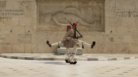 Guards passing at the tomb of the unknown soldier near the greek parliament Stock Footage 68033744