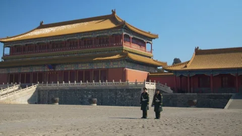 Guards Standing in Front of Traditional Palace Buildings in Forbidden City Stock Footage 345830961