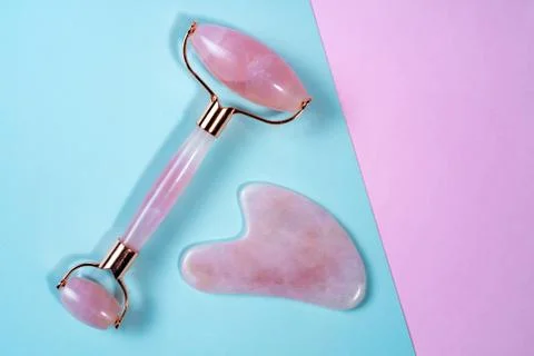 Guasha face massage device scraper for beautiful skin Stock Photos