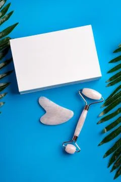 Guasha face massage device scraper for beautiful skin Stock Photos