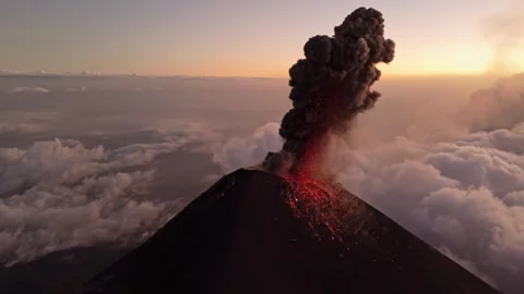 Guatemala active volcano eruption and spitting lava, aerial view Stock Footage 311015706
