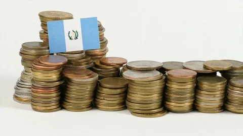 Guatemalan flag waving with stack of money coins Stock Footage 71932778
