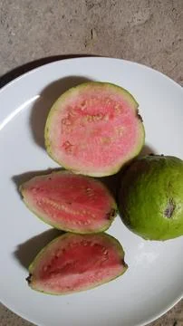 Guava inside is red on a plate Stock Photos