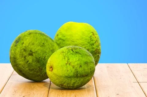 Guavas close-up 3d rendering with realistic texture on the wooden table Stock Illustration