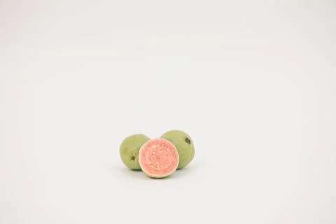 Guavas on the white background Stock Photos