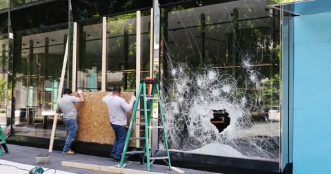 A Gucci store is boarded up after being looted in Washington, DC Stock Footage 131490910