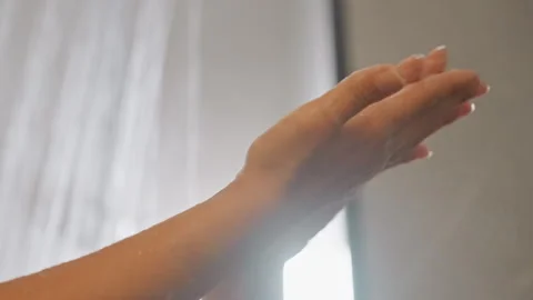 Guest concludes with cleansing gesture. Warm cascade leaves guest feeling Stock Footage 345138212