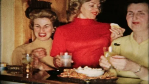 Guest gather at the man cave bar for holiday party 1950s vintage home movie 5795 Video stock 124172984