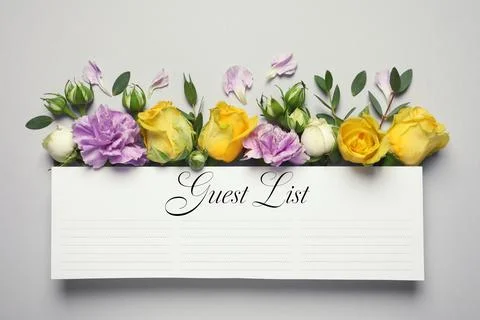 Guest list and beautiful flowers on light grey background, flat lay Stock Photos