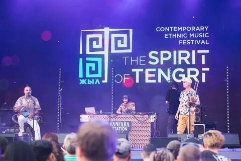 A guest musical group performs on stage of contemporary ethnic music festival in Stock Photos