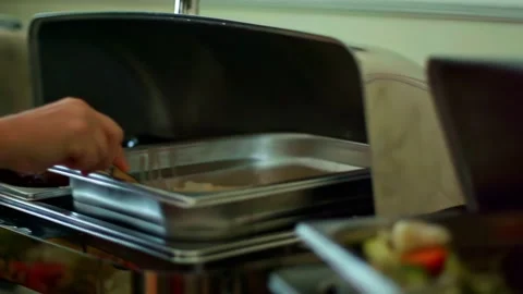 Guest Serving Food at Buffet With Fresh Meat, Vegetables and Hot Dishes Stock Footage 333781882