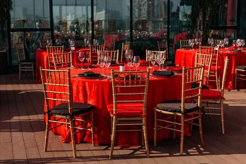 Guest table setting for banquet in black, red and gold style. Elegant and luxury Stock Photos
