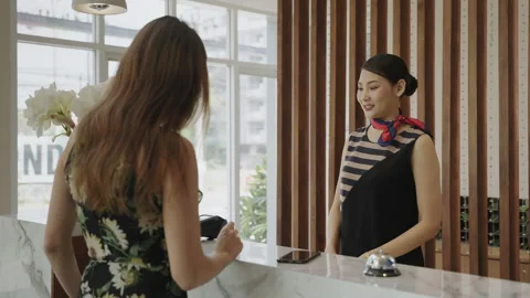 The guest is using a credit card with the edc machine to pay Stock Footage 161054128